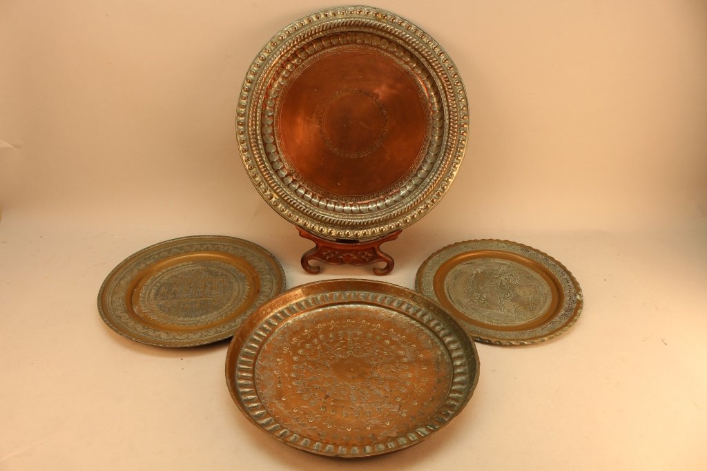 Lot of 4 middle eastern copper salvers: Lot of 4 middle eastern copper salvers. Dimensions: (S-L) 10.5 / 11.75 / 13 / 15 in.