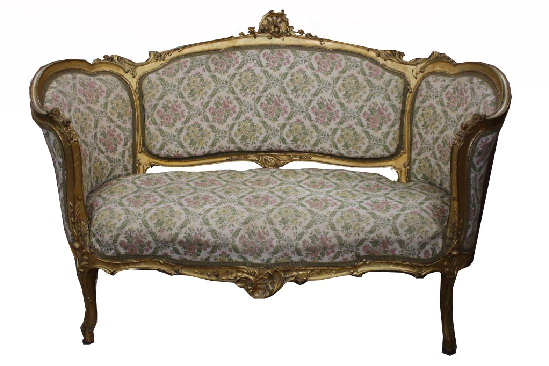French Louis XIV Style Settee: French Louis XIV Style Settee. Floral fabric Upholstery. Dimensions: 39 x 59.5 x 30.5 in.