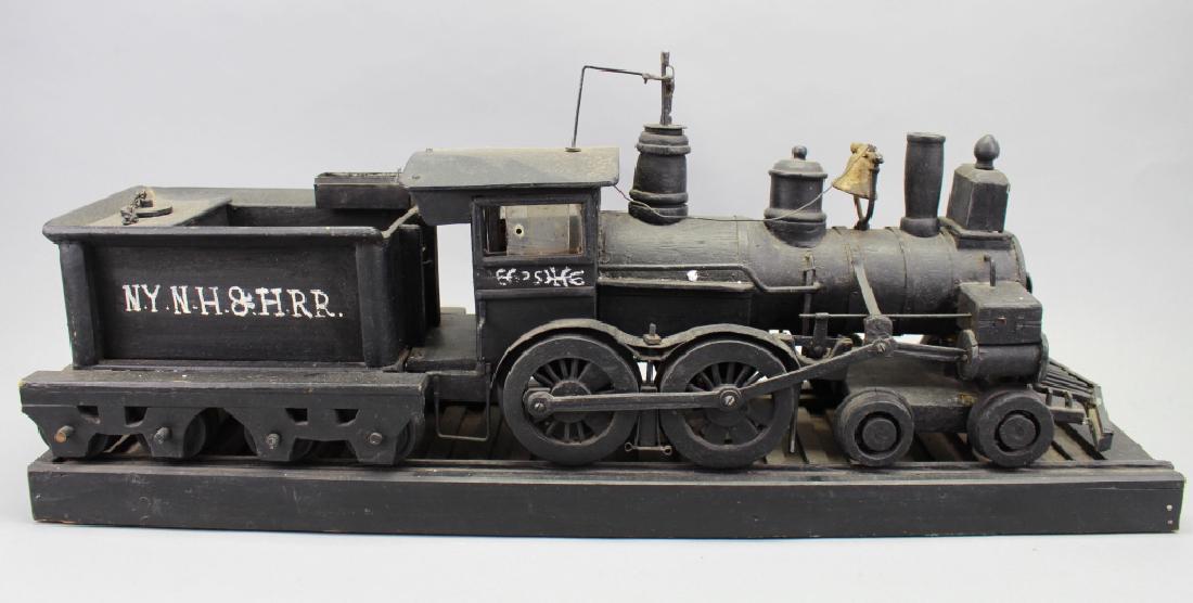 NY, New Haven & Hartford Folk Art Train: NY, New Haven & Hartford Folk Art Train. Length: 26 inches. The New York, New Haven and Hartford Railroad (reporting mark NH), commonly known as the New Haven, was a railroad that operated in New Engl