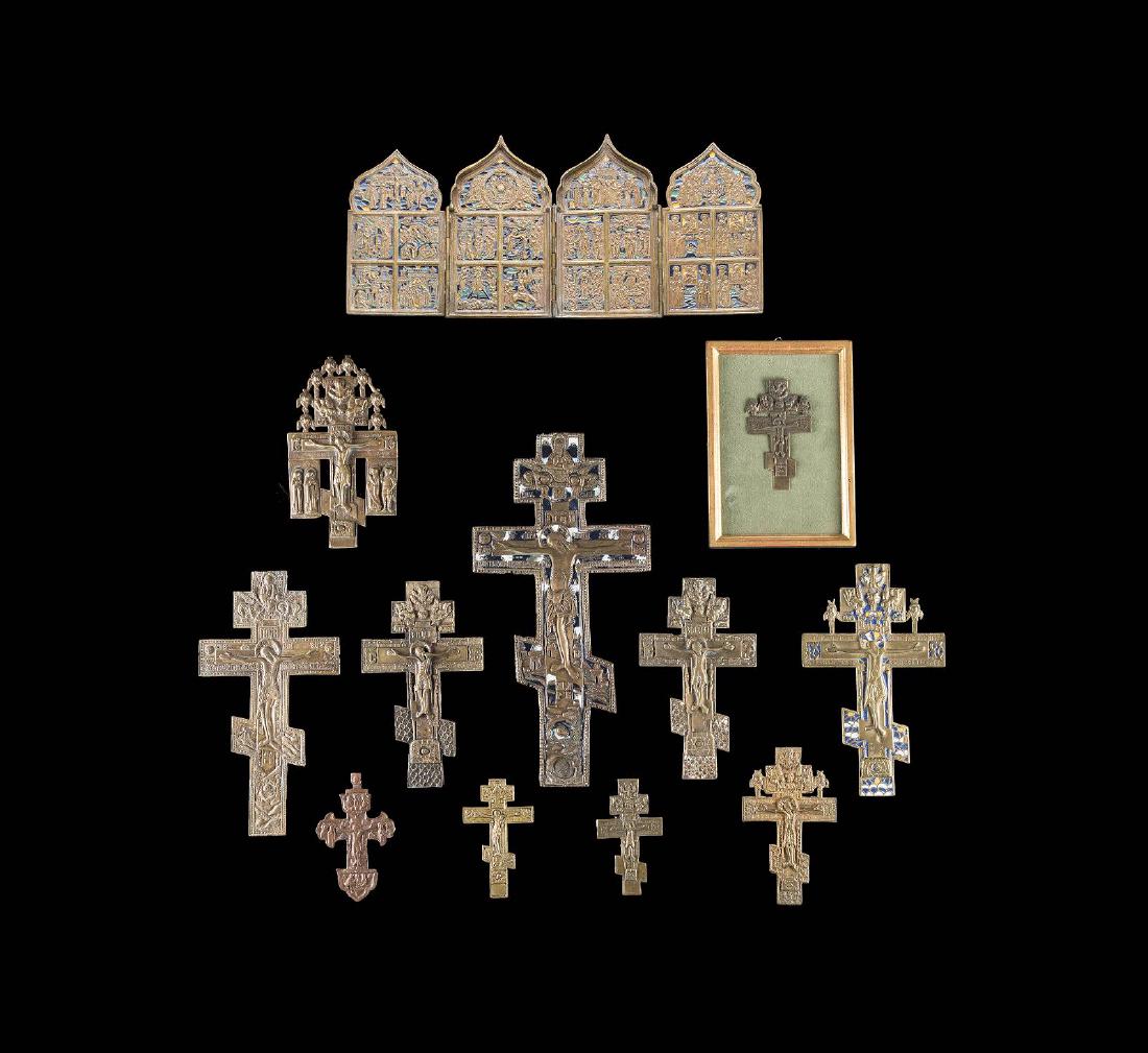 A BRASS AND ENAMEL TRIPTYCH AND ELEVEN BRASS CRUCIFIXES (1 of 1)