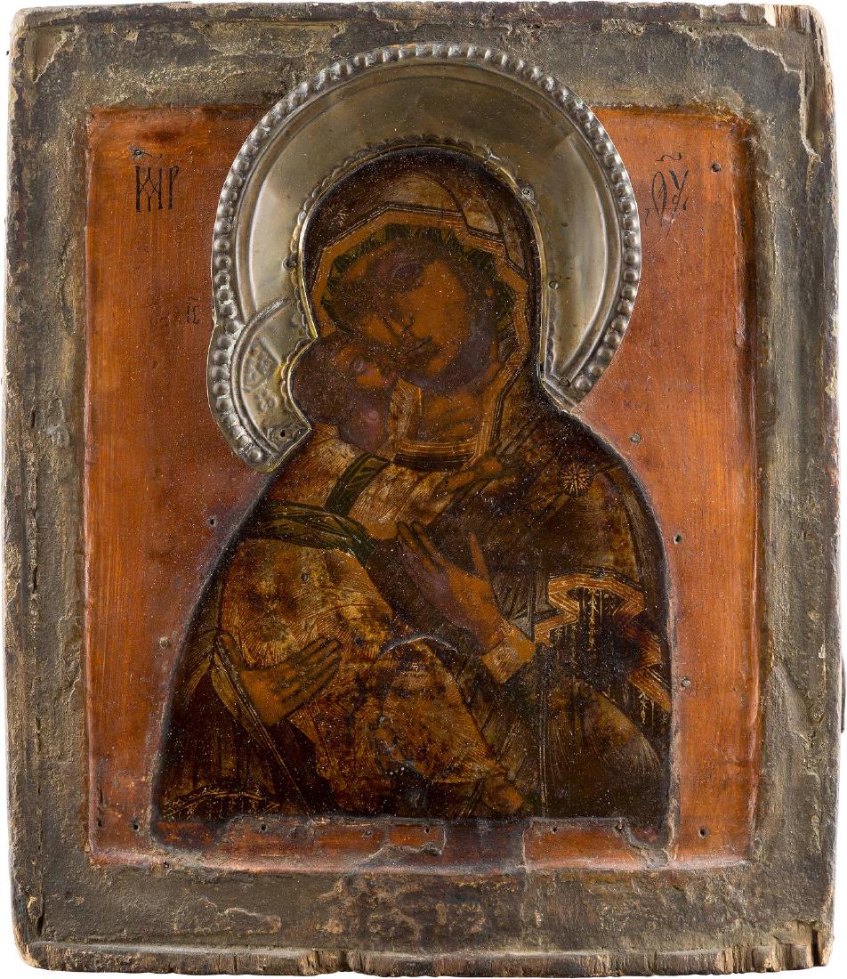 AN ICON SHOWING THE WLADIMIRSKAYA MOTHER OF GOD: AN ICON SHOWING THE WLADIMIRSKAYA MOTHER OF GOD Russian, 18th century Tempera on wood panel with double kovcheg. The folds of the garments made in silver, covered by golden lacquer. The background and