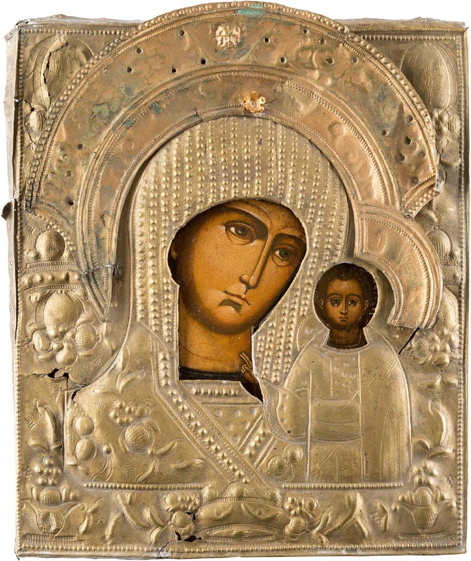 AN ICON SHOWING THE KAZANSKAYA MOTHER OF GOD WITH OKLAD: AN ICON SHOWING THE KAZANSKAYA MOTHER OF GOD WITH OKLAD Russian, mid 19th century Tempera and oil on wood panel. Covered by a chased brass oklad. Damages to the oklad. 28.7 x 24.5 cm. IKONE MIT DER GO