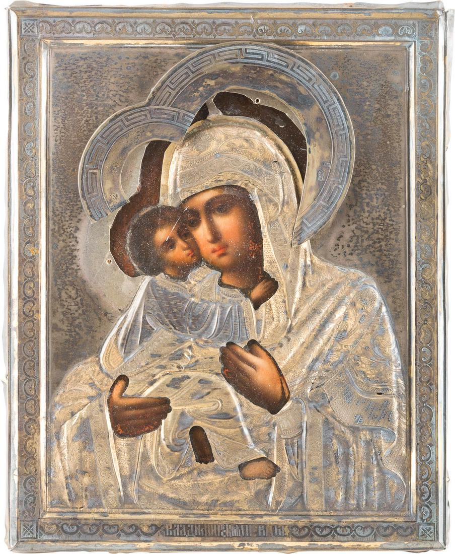 A SMALL ICON SHOWING THE VLADIMIRSKAYA MOTHER OF GOD: A SMALL ICON SHOWING THE VLADIMIRSKAYA MOTHER OF GOD WITH A SILVER-GILT OKLAD Russian, late 19th century (icon), Russian, Moscow, 1896 (oklad) Oil on wood panel with velvet backing. Overlaid with a si