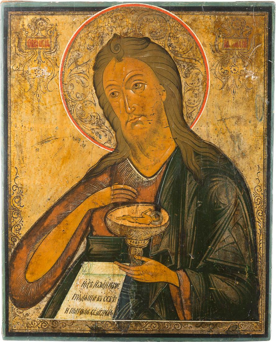 A LARGE ICON SHOWING ST. JOHN THE FORERUNNER FROM A: A LARGE ICON SHOWING ST. JOHN THE FORERUNNER FROM A DEISIS Russian, 2nd half 19th century Tempera on wood panel. The background made of silver, covered by a golden lacquer. The halo ornately punched. 