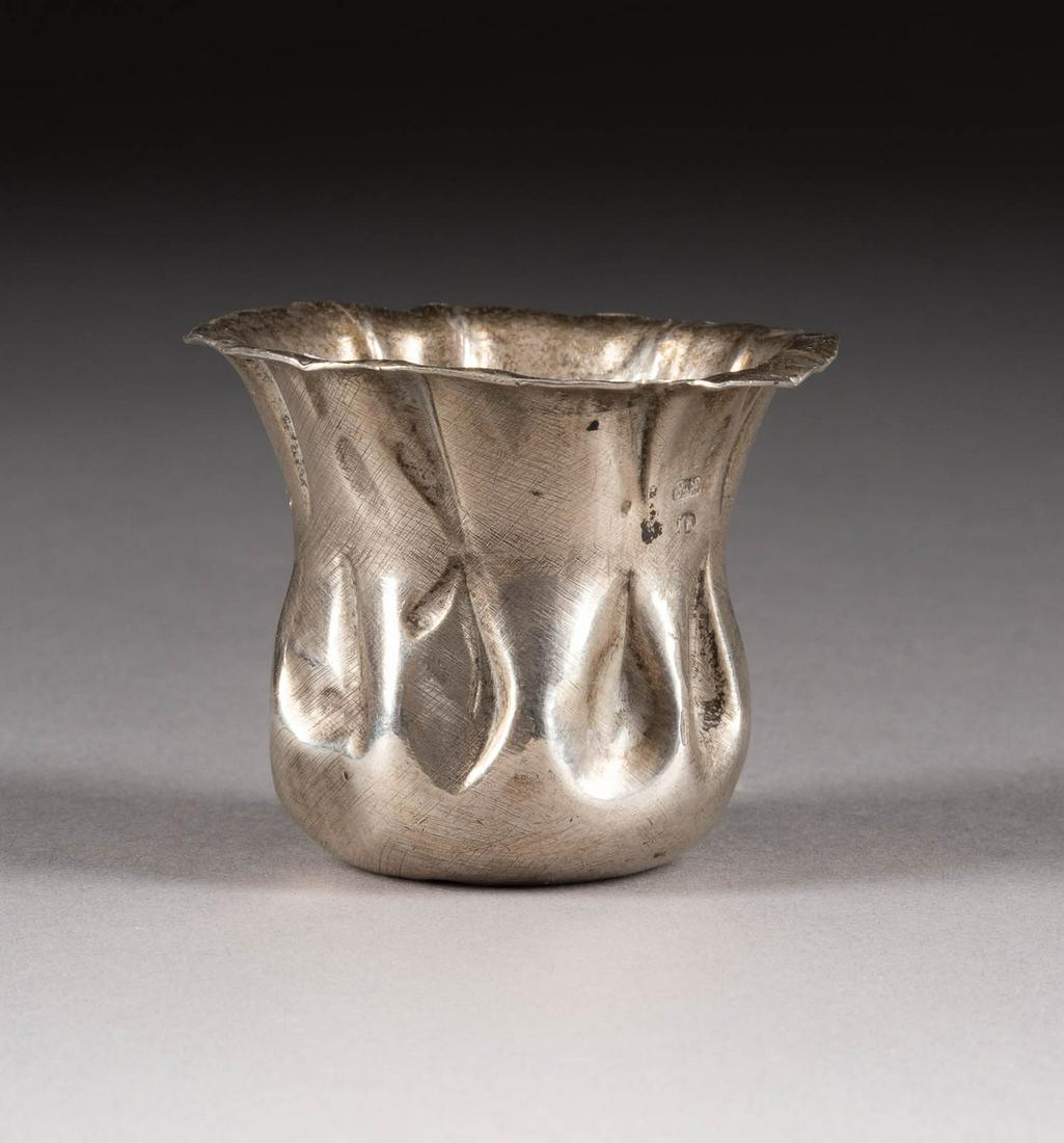 A SILVER TROMPE L'OEIL VODKA BEAKER Russian, St.: A SILVER TROMPE L'OEIL VODKA BEAKER Russian, St. Petersburg, late 19th century Marked with city hallmark, 84 standard and master's mark 'NJa' in Cyrillic. 4 cm high, 51 gr. TROMPE L'OEIL WODKA-BECHER 