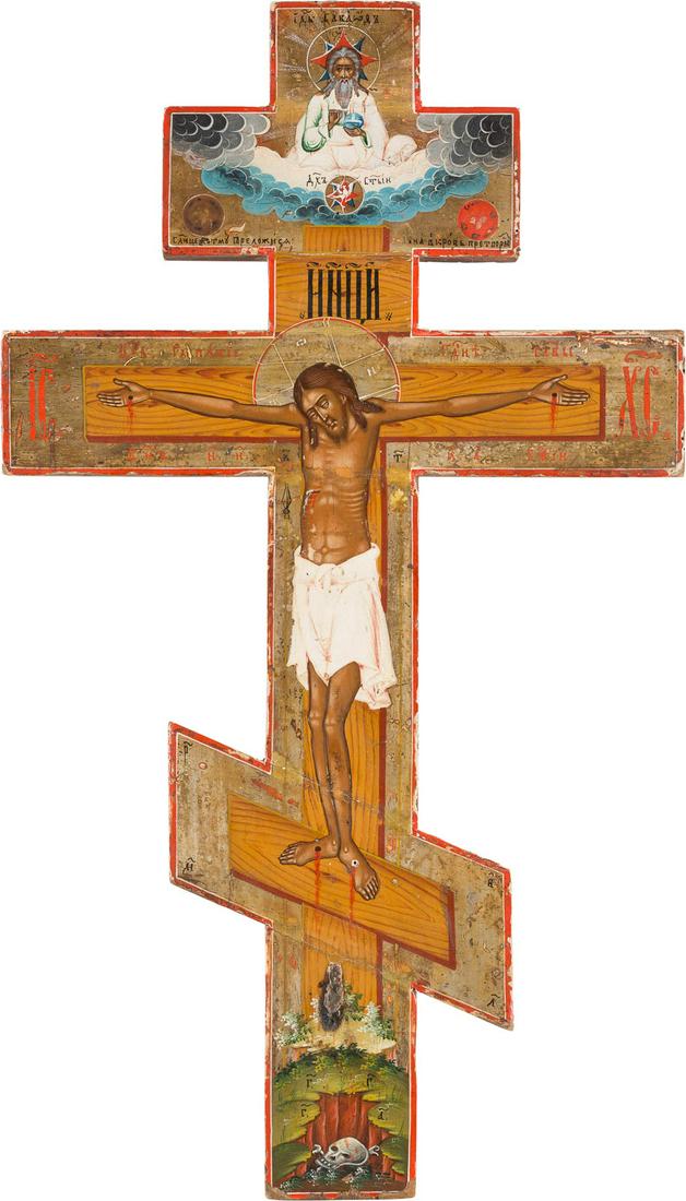 A LARGE CRUCIFIX Russian, 19th century Tempera on wood: A LARGE CRUCIFIX Russian, 19th century Tempera on wood panel. The background made of silver, covered by a golden lacquer. The edges minimally chipped, minimally restored. 56 x 32 cm.GROSSES KRUZIFIX R