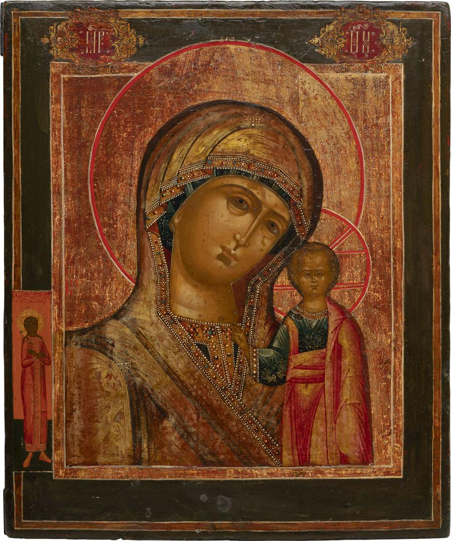 AN ICON SHOWING THE KAZANSKAYA MOTHER OF GOD: AN ICON SHOWING THE KAZANSKAYA MOTHER OF GOD Russian, late 18th century Tempera on wood panel. Executed on a gold ground. On the left border appearing a female saint. Minor areas of retouching. 35.5 x