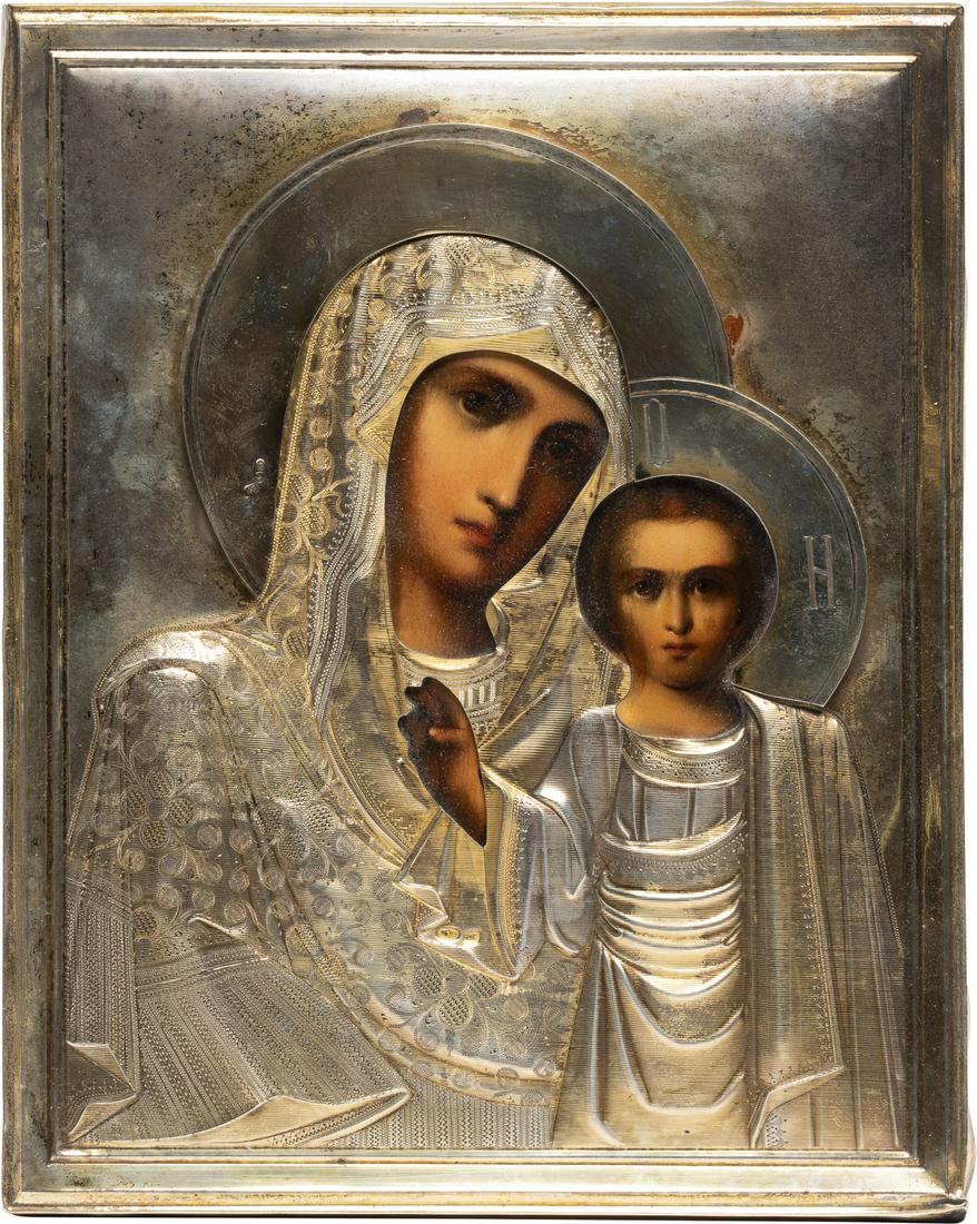 A SMALL ICON SHOWING THE KAZANSKAYA MOTHER OF GOD WITH: A SMALL ICON SHOWING THE KAZANSKAYA MOTHER OF GOD WITH A SILVER-GILT OKLAD Russian, early 20th century (icon), Russian, Moscow, 1908-1917 (oklad) Oil on wood panel with velvet backing. Overlaid with a