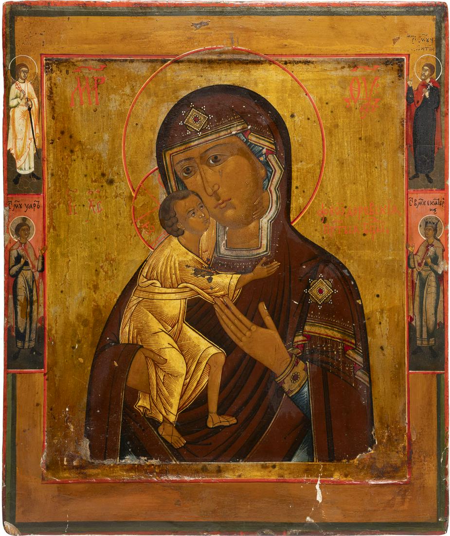 AN ICON SHOWING THE FEODOROVSKAYA MOTHER OF GOD: AN ICON SHOWING THE FEODOROVSKAYA MOTHER OF GOD Russian, circa 1900 Tempera on wood panel with kovcheg. The background made of silver, covered by a golden lacquer. Four selected saints on the borders,