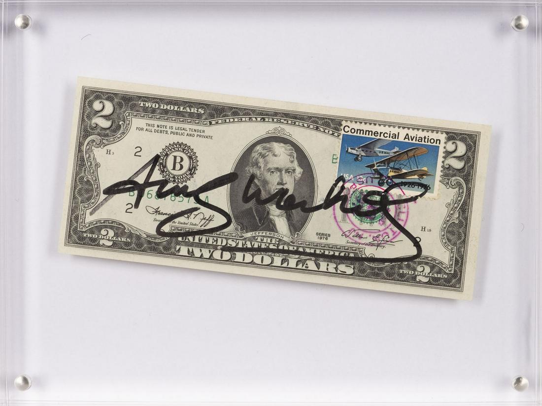 '2 DOLLARS (THOMAS JEFFERSON)' (1976): ANDY WARHOL1928 Pittsburgh - 1987 New York'2 DOLLARS (THOMAS JEFFERSON)' (1976) Ready-made, 2-Dollar-Note mit Stempel 'Commercial Aviation', in Plexiglas. 15 x 20 x 2 cm. Handsigniert 'An