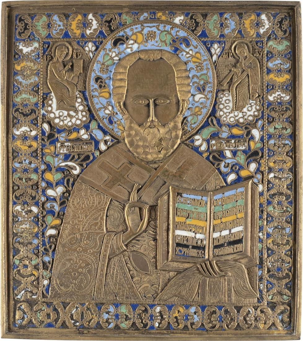GROSSE BRONZE-IKONE MIT DEM HEILIGEN NIKOLAUS VON MYRA: A LARGE BRASS ICON SHOWING ST. NICHOLAS OF MYRA Russian, 19th century Cast in relief and enamelled in yellow, white, black, blue and green. Enamel partially chipped. 27 x 24 cm.GROSSE BRONZE-IKONE MIT