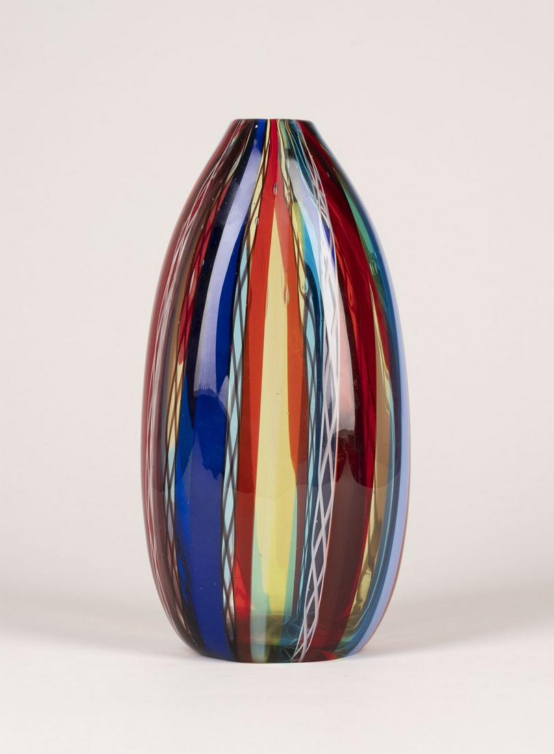 FULVIO BIANCONI, OVALE VASE: FULVIO BIANCONI 1915 Padua - 1996 Milan OVAL VASE Italy, Murano, Cenedese, 1964 Colourless glass with polychrome vertical rods and threads, polished bottom. H. 29 cm, w. 14 cm, d. 10 cm. Marked undern