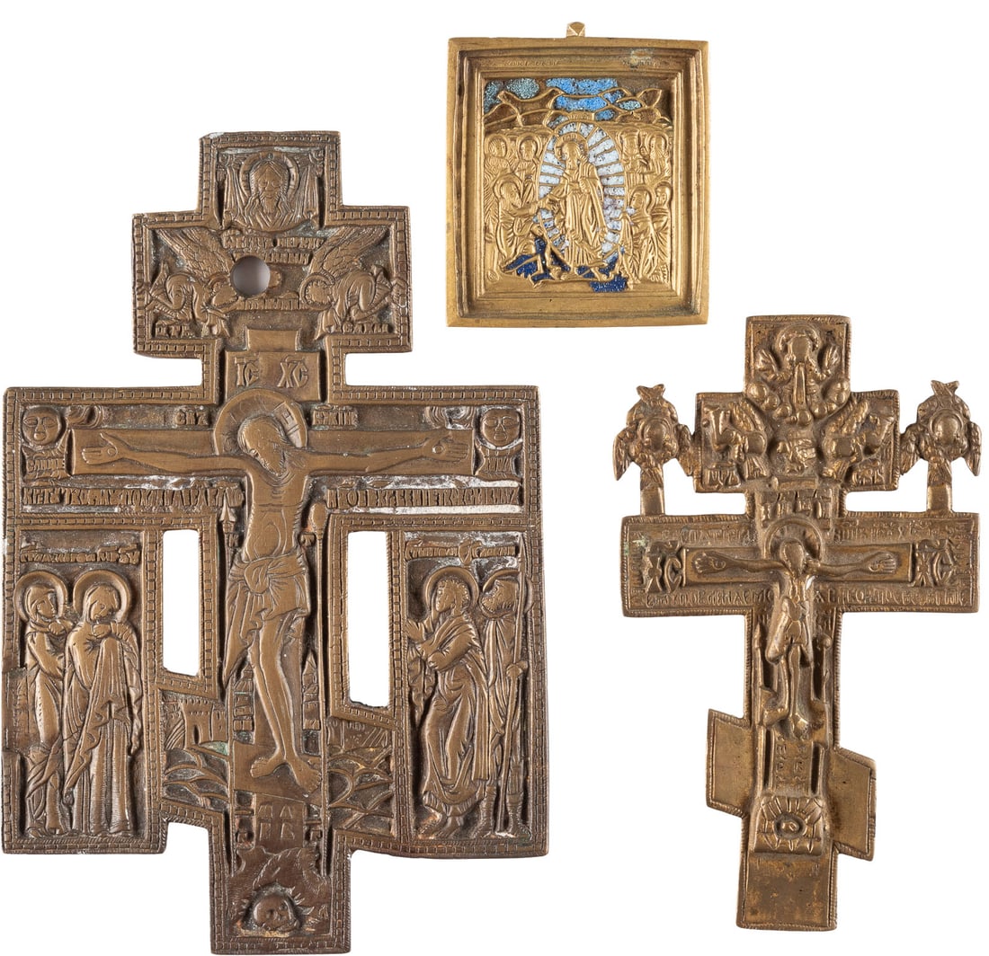 TWO BRASS CRUCIFIXES AND A BRASS AND ENAMEL ICON SHOWING THE DESCENT INTO HELL: TWO BRASS CRUCIFIXES AND A BRASS AND ENAMEL ICON SHOWING THE DESCENT INTO HELL Russian, 19th century Cast in relief, one icon enamelled in blue and white. Drill hole, enamel chipped. 6-16.4 cm high.DR