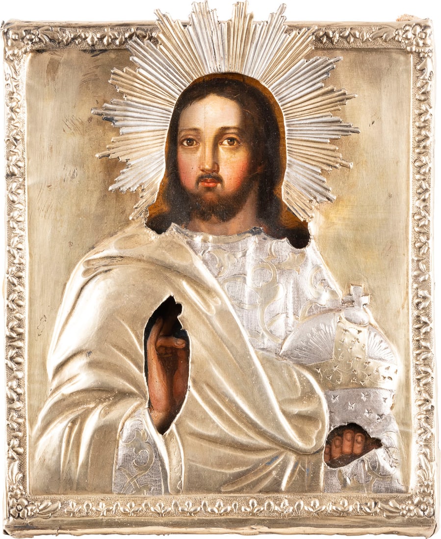 A SMALL ICON SHOWING CHRIST THE SAVIOUR WITH A SILVER-GILT OKLAD: A SMALL ICON SHOWING CHRIST THE SAVIOUR WITH A SILVER-GILT OKLAD Russian, mid 19th century (icon), Russian, Moscow, 1852 (oklad) Oil on wood panel with velvet backing. Overlaid with a silver-gilt okla