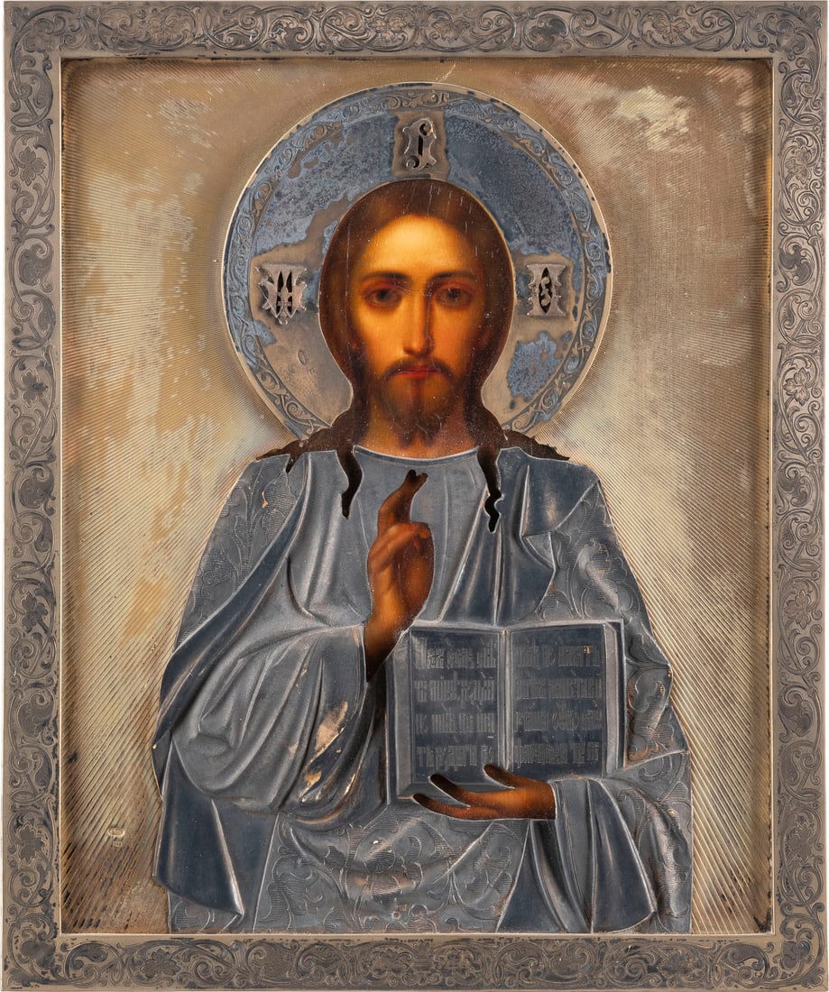 A FINE ART NOUVEAU ICON SHOWING CHRIST PANTOKRATOR WITH A SILVER-GILT OKLAD: A FINE ART NOUVEAU ICON SHOWING CHRIST PANTOKRATOR WITH A SILVER-GILT OKLAD Russian, early 20th century (icon), Russian, Moscow, 1908-1917 (oklad) Oil on wood panel with velvet backing. Overlaid with