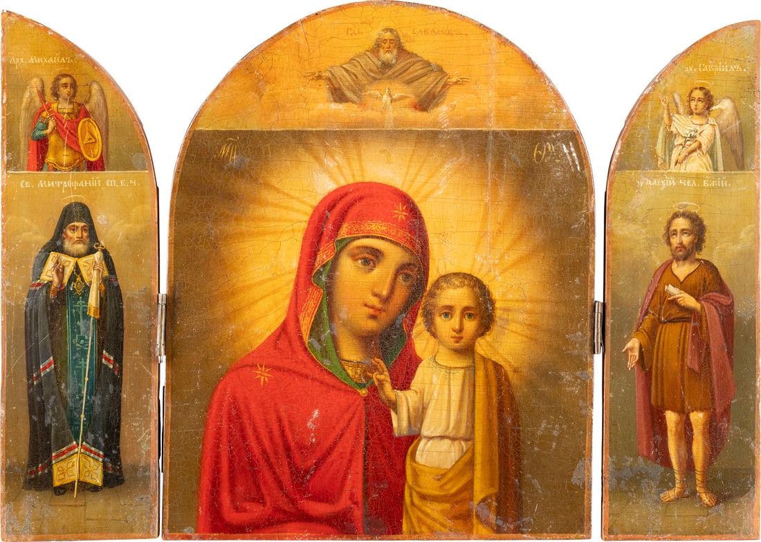 A FINE TRIPTYCH SHOWING THE KAZANSKAYA MOTHER OF GOD FLANKED BY THE ARCHANGELS MICHAEL AND: A FINE TRIPTYCH SHOWING THE KAZANSKAYA MOTHER OF GOD FLANKED BY THE ARCHANGELS MICHAEL AND GABRIEL AND STS. MITROPHAN OF VORONEZH AND ALEXIUS, THE MAN OF GOD Russian, mid 19th century Oil on wood pane