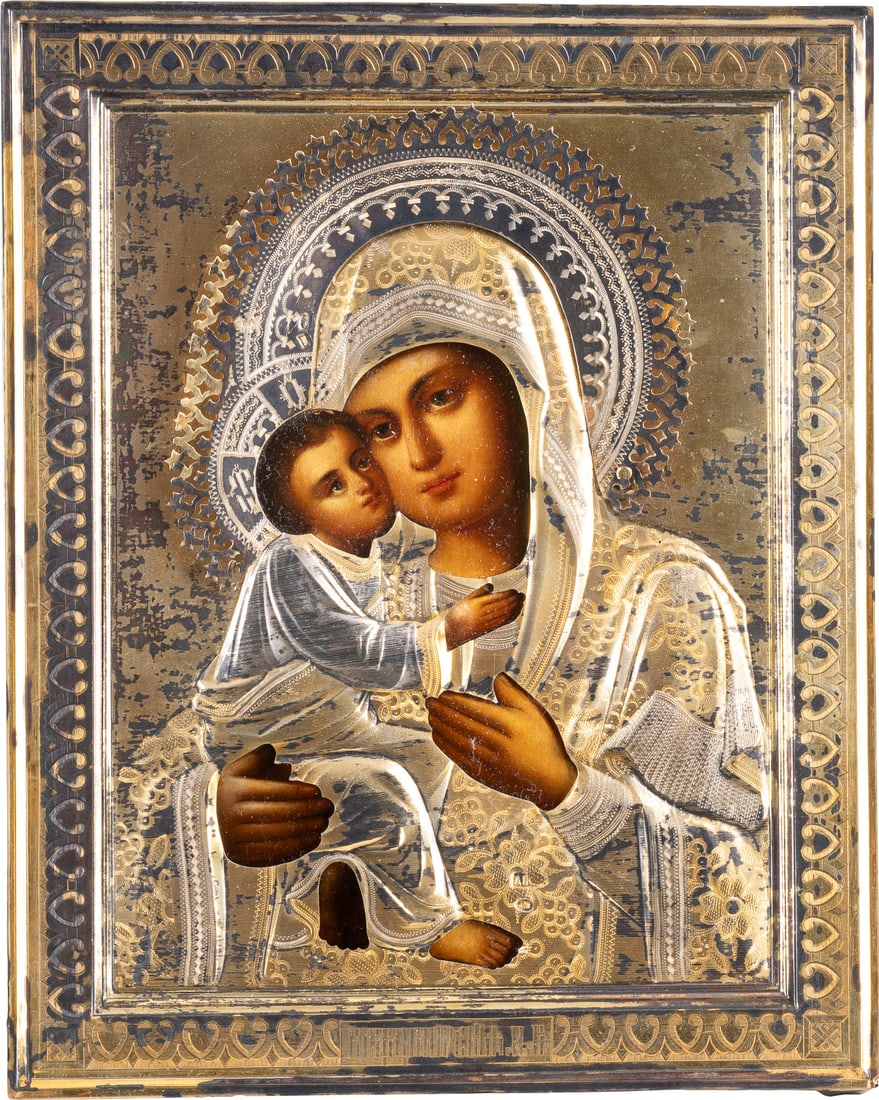 A SMALL ICON SHOWING THE VLADIMIRSKAYA MOTHER OF GOD WITH A SILVER-GILT OKLAD: A SMALL ICON SHOWING THE VLADIMIRSKAYA MOTHER OF GOD WITH A SILVER-GILT OKLAD Russian, circa 1900 (icon), Russian, Moscow, 1896-1908 (oklad) Oil on wood panel with velvet backing. Overlaid with an eng