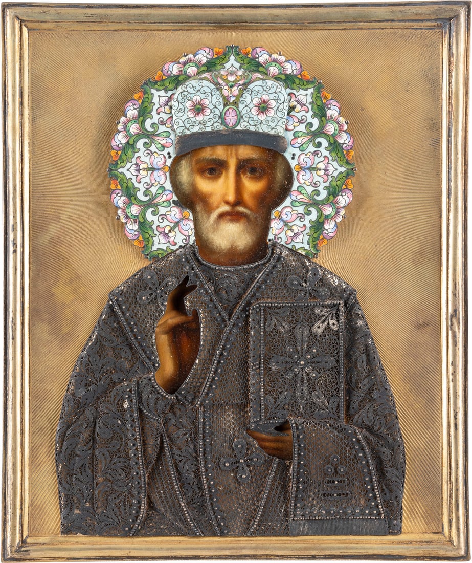 A VERY FINE ICON SHOWING ST. NICHOLAS OF MYRA WITH A SILVER-GILT, FILIGREE AND CLOISONNE: A VERY FINE ICON SHOWING ST. NICHOLAS OF MYRA WITH A SILVER-GILT, FILIGREE AND CLOISONNE ENAMEL OKLAD Russian, early 20th century (icon), Russian, Moscow, Ivan Vasiliev, 1908-1917 (oklad) Oil on wood