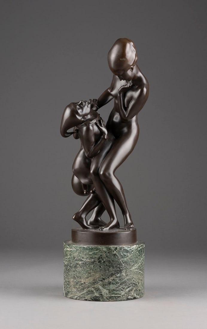 HEINRICH KARL SCHOLZ: HEINRICH KARL SCHOLZ 1880 Mildenau (Bohemia) - 1937 Vienna FEMALE NUDE WITH A FOOL IN LOVE Bronze, dark patina, on a round plinth and cylindrical marble base (h. 13 cm). Overall h. 61, w. 19.5, d. 19.
