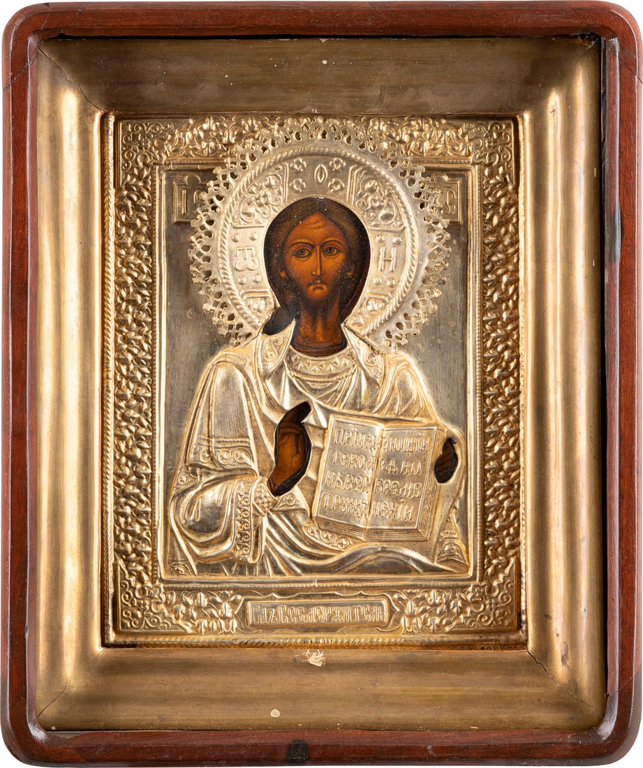IKONE MIT CHRISTUS PANTOKRATOR MIT OKLAD IM KIOT: AN ICON SHOWING CHRIST PANTOKRATOR WITH OKLAD WITHIN KYOT Russian, late 19th century Tempera on wood panel. Overlaid with a chased and embossed brass oklad. 29.5 x 24.7 cm._x0013_IKONE MIT CHRISTUS PA