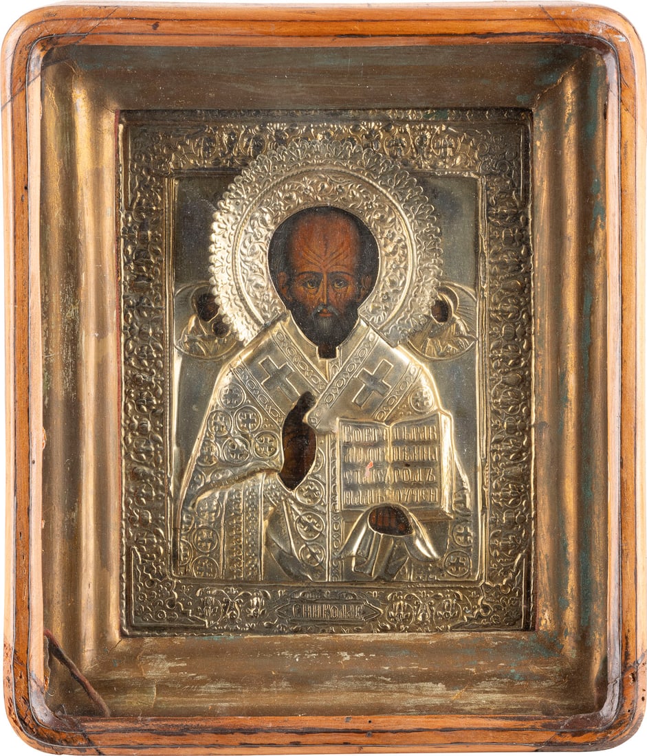 IKONE MIT DEM HEILIGEN NIKOLAUS VON MYRA MIT OKLAD IM KIOT: AN ICON SHOWING ST. NICHOLAS OF MYRA WITH OKLAD WITHIN KYOT Russian, 2nd half 19th century Tempera on wood panel. Overlaid with a chased brass oklad. 29.6 x 25.4 cm (with glazed kyot)._x0013_IKONE MIT