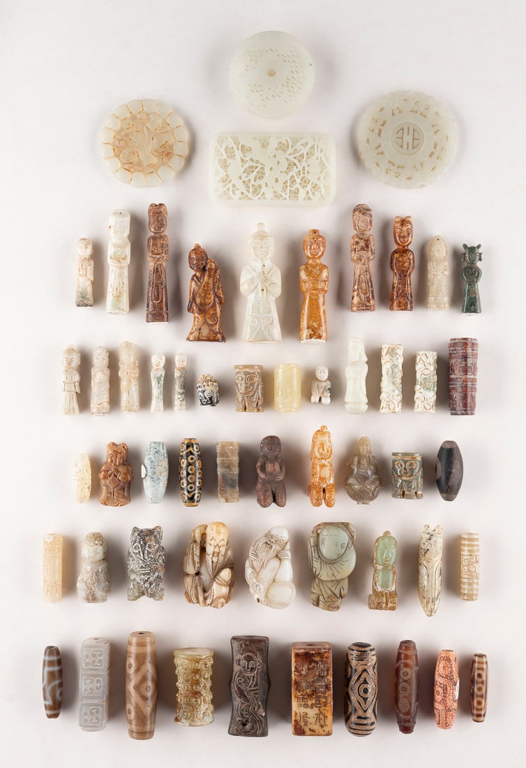 A LARGE GROUP OF STONE AND JADE CARVINGS China Stone. H. of the largest 7 cm. The collection include (1 of 1)