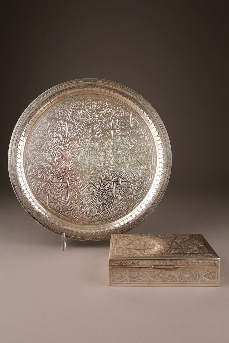 A SILVER BOX AND A ROUND PLATE Egypt, Cairo, betw. 1965-1967 The box in wood, silver panelled, the p (1 of 1)