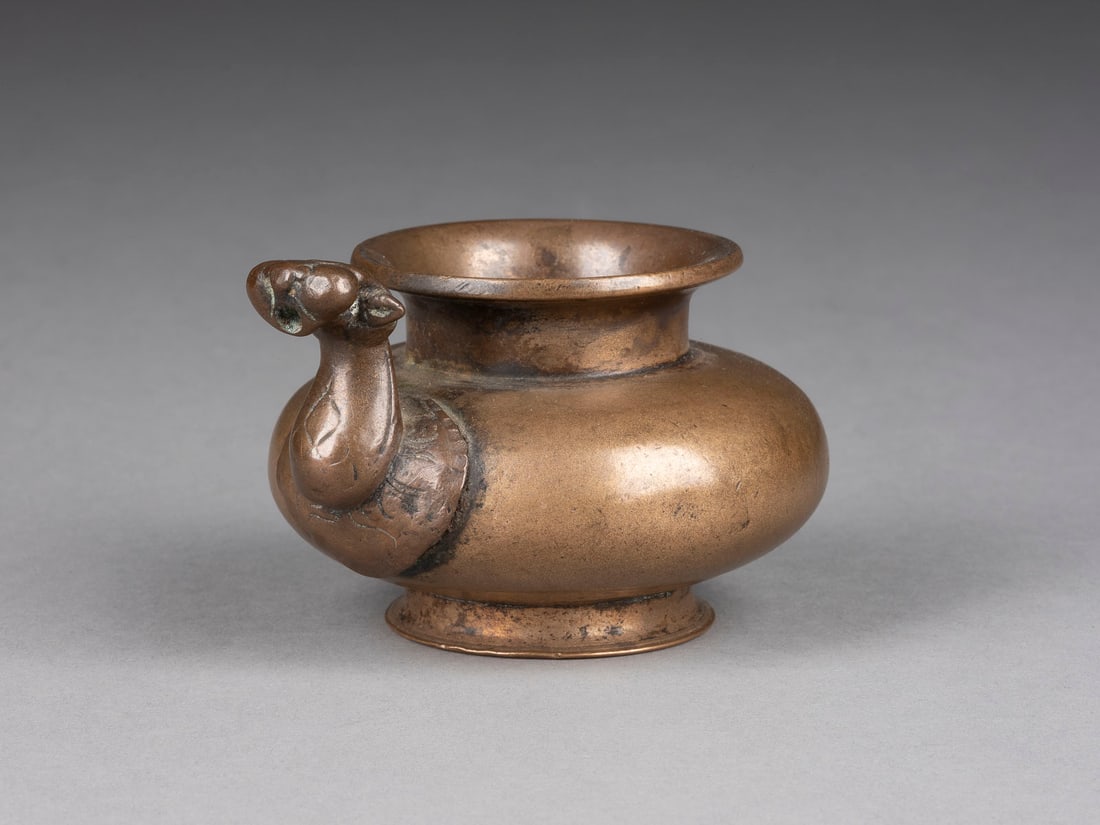 A BRONZE WATER DROPPER (1 of 1)