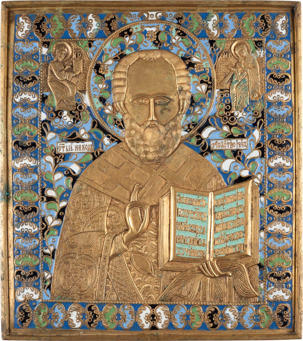 FEINE GROSSE BRONZE-IKONE MIT DEM HEILIGEN NIKOLAUS VON MYRA: A FINE LARGE BRASS AND ENAMEL ICON SHOWING ST. NICHOLAS OF MYRA Russian, 19th century Cast in relief, six-colour enamelled. Enamel min. chipped. 27.5 cm high.FEINE GROSSE BRONZE-IKONE MIT DEM HEILIGEN