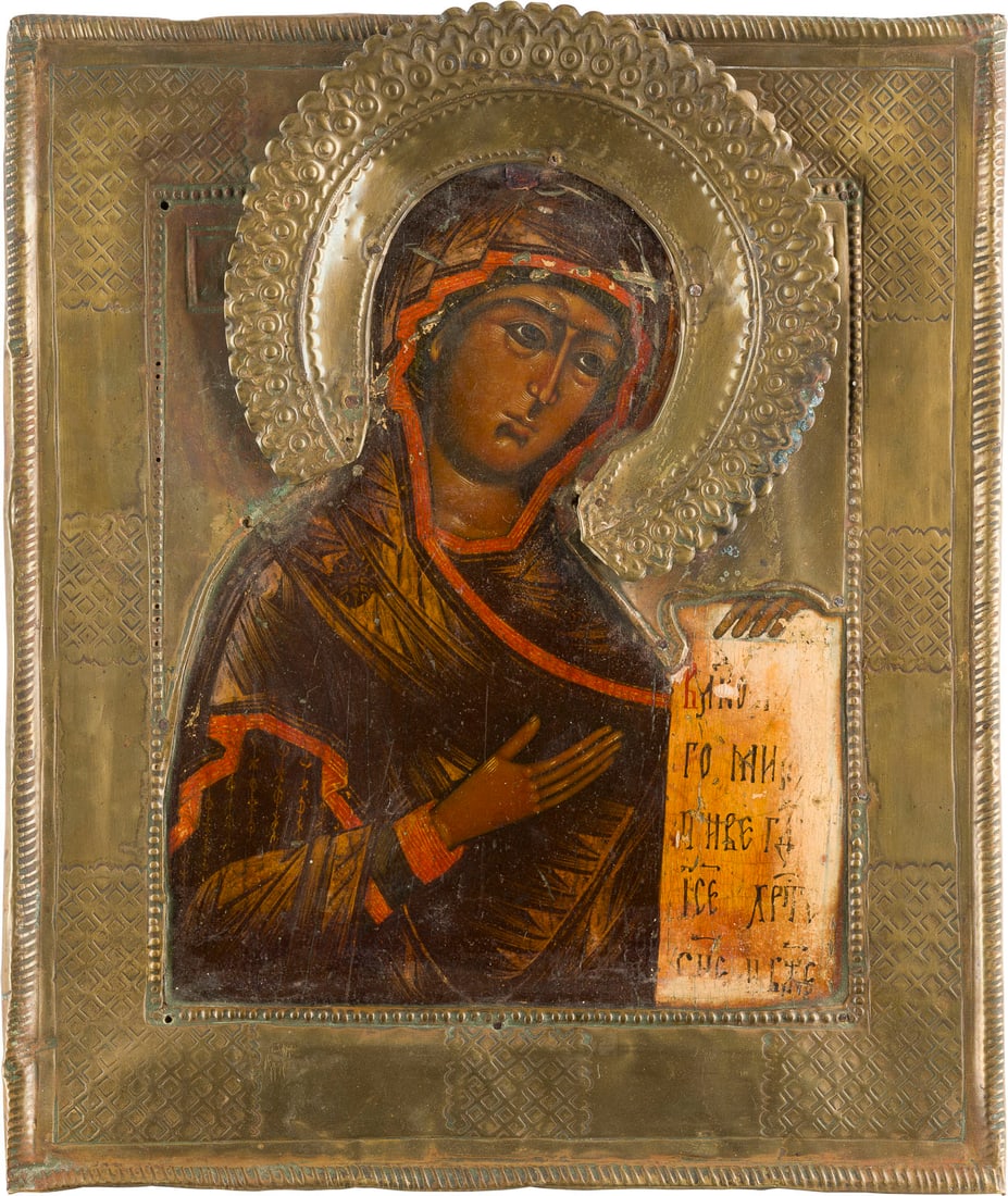 IKONE MIT DER GOTTESMUTTER AUS EINER DEESIS MIT RIZA: AN ICON SHOWING THE MOTHER OF GOD FROM A DEISIS WITH RIZA Russian, 19th century Tempera on wood panel. Overlaid with a brass riza ornately incised. Minimally restored. 29.5 x 25.2 cm.IKONE MIT DER GOT