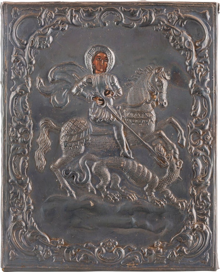 KLEINE IKONE MIT DEM HEILIGEN GEORG DEM DRACHENTÖTER MIT SILBER-OKLAD: A SMALL ICON SHOWING ST. GEORGE KILLING THE DRAGON WITH A SILVER OKLAD 20th century Tempera on wood panel with velvet backing. Overlaid with a chased silver oklad. Bearing spuious hallmark '84'. 20.6 