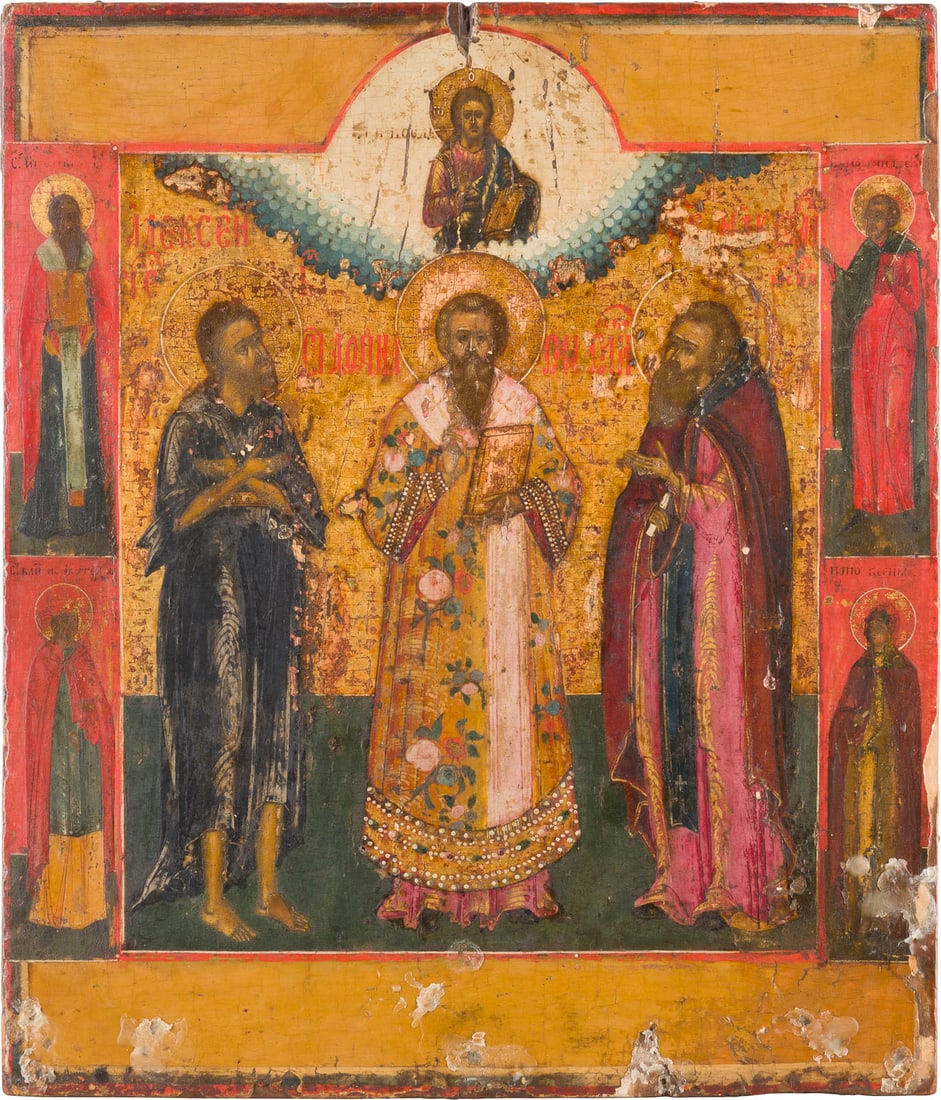 IKONE MIT DREI HEILIGEN, DARUNTER DER HEILIGE ALEXIUS, MANN GOTTES: AN ICON SHOWING THREE SELECTED SAINTS, ST. ALEXIUS, MAN OF GOD AMONG THEM Russian, circa 1825 Tempera on wood panel. Executed in bright colours against a golden background. Four selected saints on the