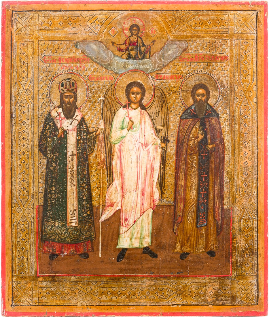 IKONE MIT DEM SCHUTZENGEL FLANKIERT VON DEN HEILIGEN FEODOSIJ VON UGLITSCH UND GERMAN: AN ICON SHOWING THE GUARDIAN ANGEL FLANKED BY ST. FEODOSIY OF UGLITCH AND GERMAN Russian, after 1896 Tempera on wood panel. The background made of silver, covered by a golden lacquer. The background a