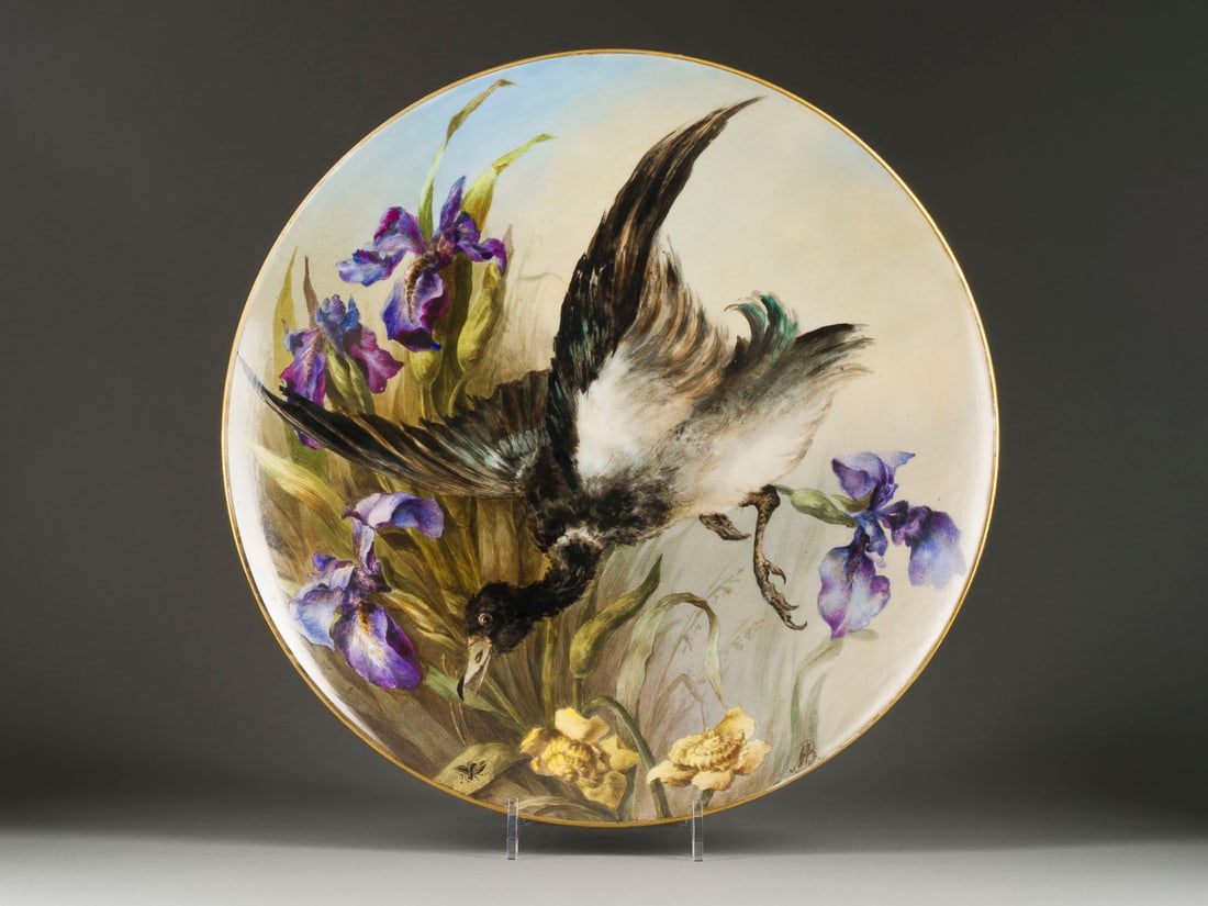 A LARGE PORCELAIN PLATTER SHOWING A BIRD: A LARGE PORCELAIN PLATTER SHOWING A BIRD Russian, St. Petersburg, Imperial Porcelain Factory, Period of Alexander III, 1885 Painted, with gilded rims. Overglaze green factory mark 'AIII' under the cro