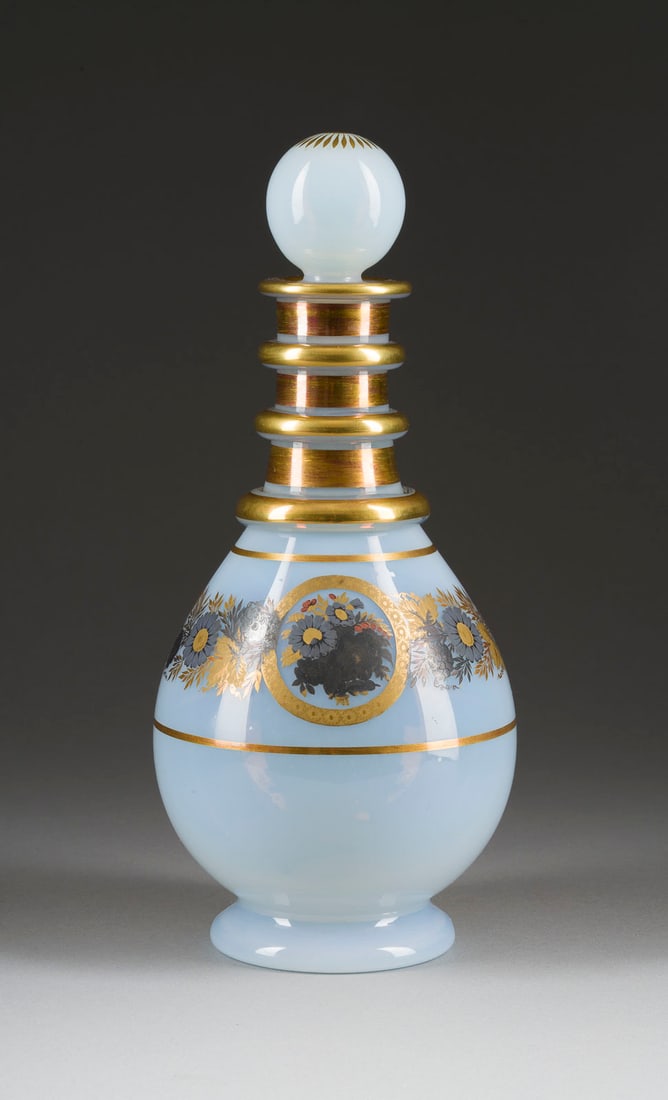 A GILT AND SILVERED MILK GLASS DECANTER WITH STOPPER: A GILT AND SILVERED MILK GLASS DECANTER WITH STOPPER Russian, St. Petersburg, Imperial Glass Factory, circa 1820 Of bottle form, on a circular foot. The body decorated with flowers and foliage. 25 cm 
