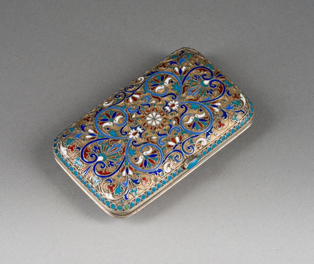 A SILVER-GILT AND CLOISONNE ENAMEL CIGARETTE CASE: A SILVER-GILT AND CLOISONNE ENAMEL CIGARETTE CASE Russian, Moscow, Gustav Klingert, 1894 Of rectangular form with rounded corners. Decorated all over with palmettes on a stippled ground in red, white,