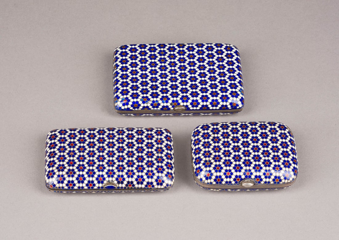 A COLLECTION OF TWO SILVER AND CHAMPLEVE ENAMEL CIGARETTE CASES AND A POWDER CASE: A COLLECTION OF TWO SILVER AND CHAMPLEVE ENAMEL CIGARETTE CASES AND A POWDER CASE Russian, Moscow, Gustav Klingert, late 19th century Of rectangular form with rounded corners. The surface enamelled ov