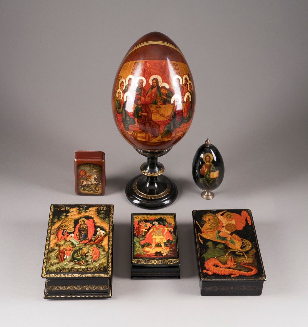 A COLLECTION OF SIX PAPIER-MACHE AND LACQUER BOXES AND EGGS AS WELL AS ONE MATRYOSHKA DOLL: A COLLECTION OF SIX PAPIER-MACHE AND LACQUER BOXES AND EGGS AS WELL AS ONE MATRYOSHKA DOLL Soviet Union/Russian, including Kholui/Fedoskino/Sergiyev Posad, 20th century With painted and partially gilt
