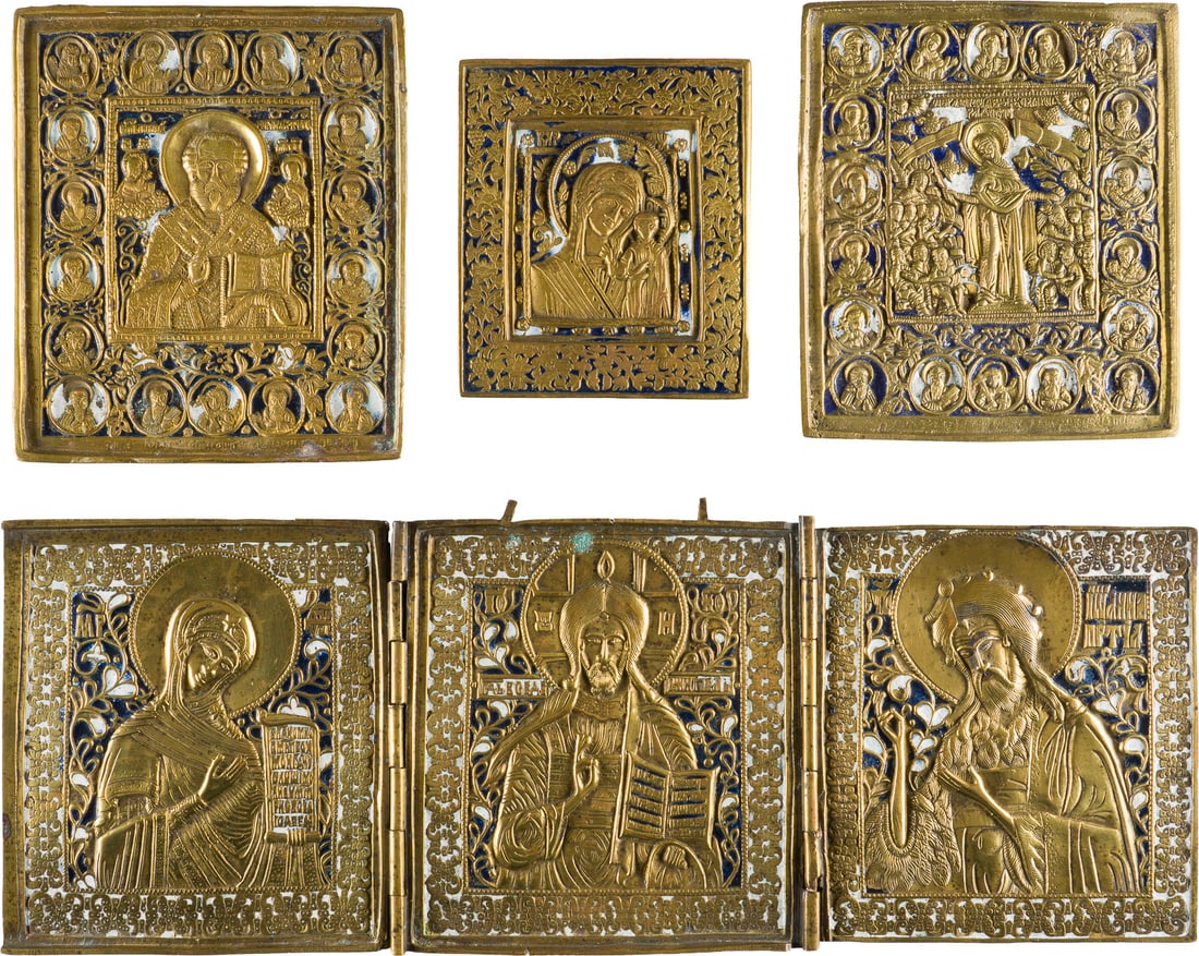 A COLLECTION OF FOUR BRASS ICONS INCLUDING IMAGES OF THE MOTHER OF GOD, ST. NICHOLAS OF: A COLLECTION OF FOUR BRASS ICONS INCLUDING IMAGES OF THE MOTHER OF GOD, ST. NICHOLAS OF MYRA AND A TRIPTYCH SHOWING DEISIS Russian, 19th century Cast in relief, enamelled in blue and white. Enamel par