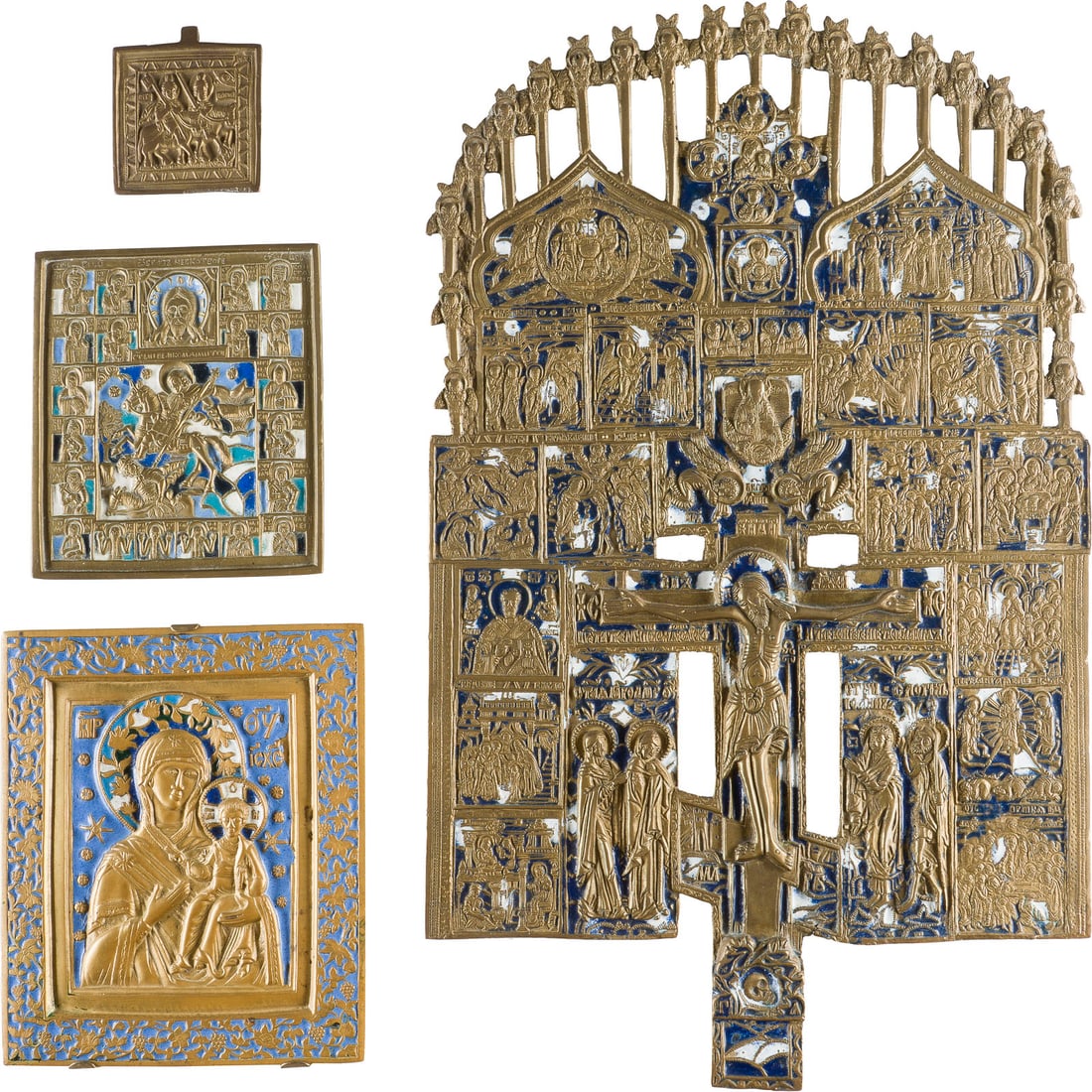 A COLLECTION OF FOUR BRASS ICONS DEPICTING EXTENDED CRUCIFIX, WARRIOR SAINTS AND THE: A COLLECTION OF FOUR BRASS ICONS DEPICTING EXTENDED CRUCIFIX, WARRIOR SAINTS AND THE MOTHER OF GOD OF SMOLENSK Russian, 19th century Cast in relief, partially two- or five-coloured enamelled. Enamel m