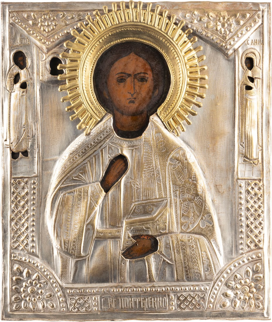 AN ICON SHOWING ST. PANTELEIMON WITH OKLAD: AN ICON SHOWING ST. PANTELEIMON WITH OKLAD Russian, 2nd half 19th century Tempera on wood panel. Two selected saints on the borders. Overlaid with a brass oklad. 31 x 26.7 cm. IKONE MIT DEM HEILIGEN P