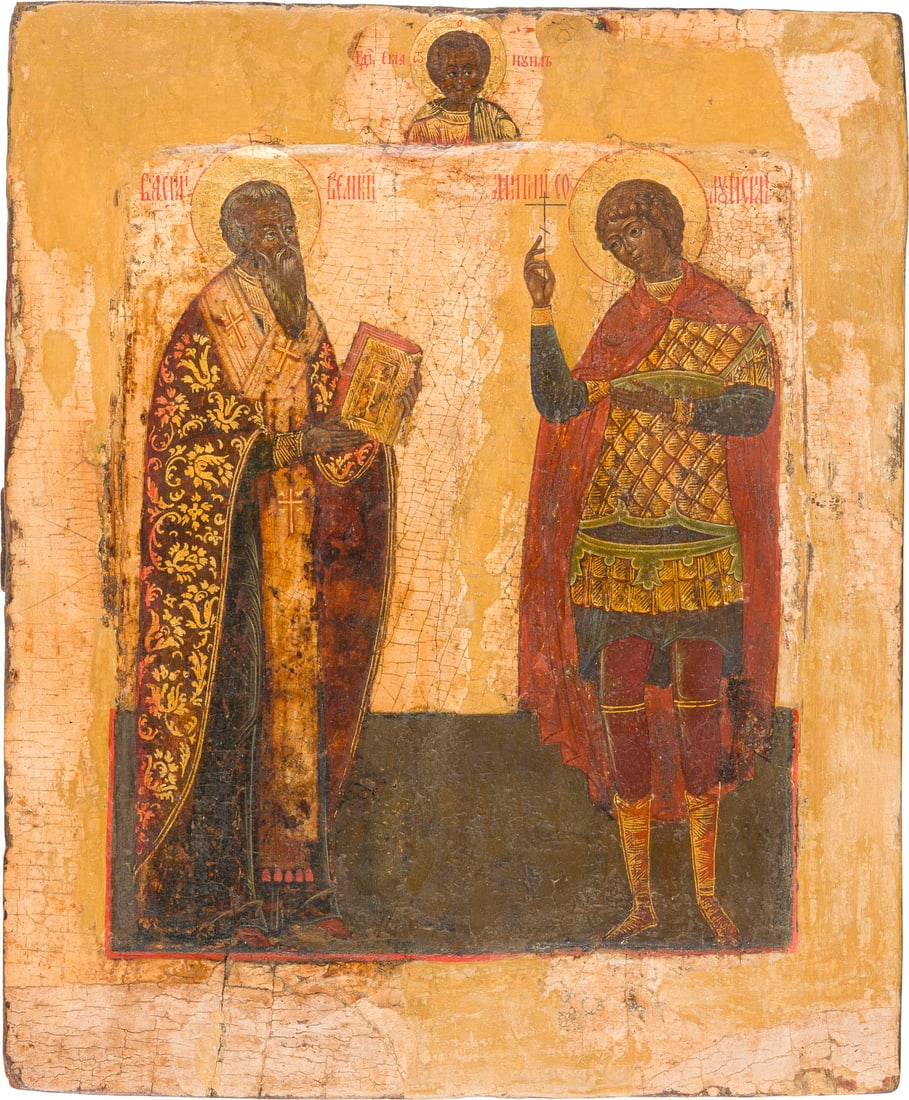 AN ICON SHOWING STS. BASIL THE GREAT AND DEMETRIUS OF SALONIKI: AN ICON SHOWING STS. BASIL THE GREAT AND DEMETRIUS OF SALONIKI Russian, 17th/19th century Tempera on wood panel with kovcheg. The haloes and the ornaments of the garments made of gold. The background 
