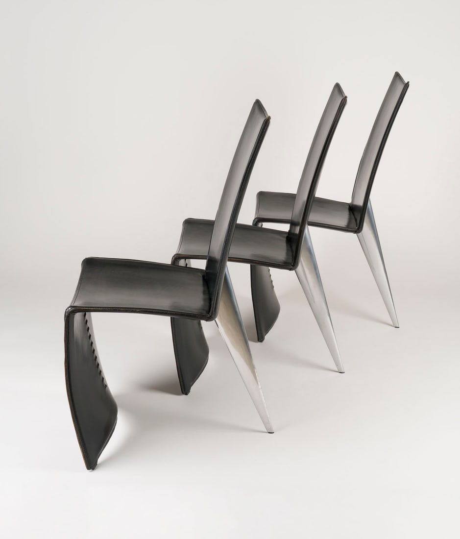PHILIPPE STARCK – DREI STUEHLE 'ED ARCHER': PHILIPPE STARCK1949 Paris SET OF THREE CHAIRS 'ED ARCHER' Italy, Driade Aleph, Design 1987 Steel frame, black leather, cast aluminium. H. 98 cm, W. 47 cm, D. 60 cm. Leather marked 'Aleph by Starck' (e
