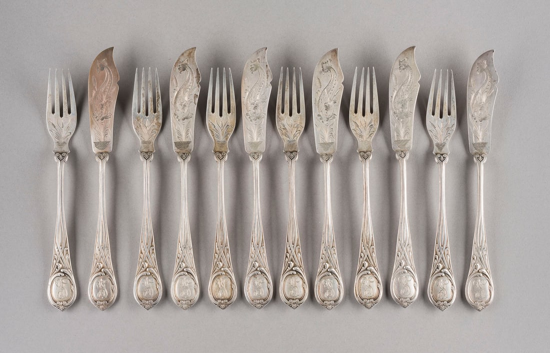 A SILVER FISH KNIVE AND FORK SET: A SILVER FISH KNIVE AND FORK SET Russian, St. Petersburg, Grachev Brothers, 1896-1908 Comprising six knives and six forks finely chased with fish, the handles with foliate ornament, with engraved init