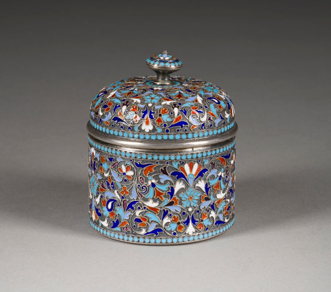 A SILVER AND CLOISONNÉ ENAMEL BOX: A SILVER AND CLOISONNÉ ENAMEL BOX Russian, Moscow, Gustav Klingert, 1896-1908 Of circular form. Gilt interior. Marked under base with assayer's mark, 84 standard and master's mark 'GK' in Cyrillic. 7
