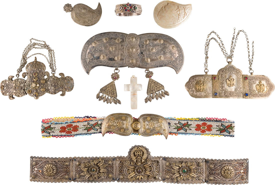 A COLLECTION OF BELTS, BELT BUCKLES, BRACELET AND MOTHER-OF-PEARL CARVINGS: A COLLECTION OF BELTS, BELT BUCKLES, BRACELET AND MOTHER-OF-PEARL CARVINGS Greece / Jerusalem, 19th century Metal, mother-of-pearl, paste stones. Some damages. 5-90 cm long. SAMMLUNG VON GÜRTELN, GÜ