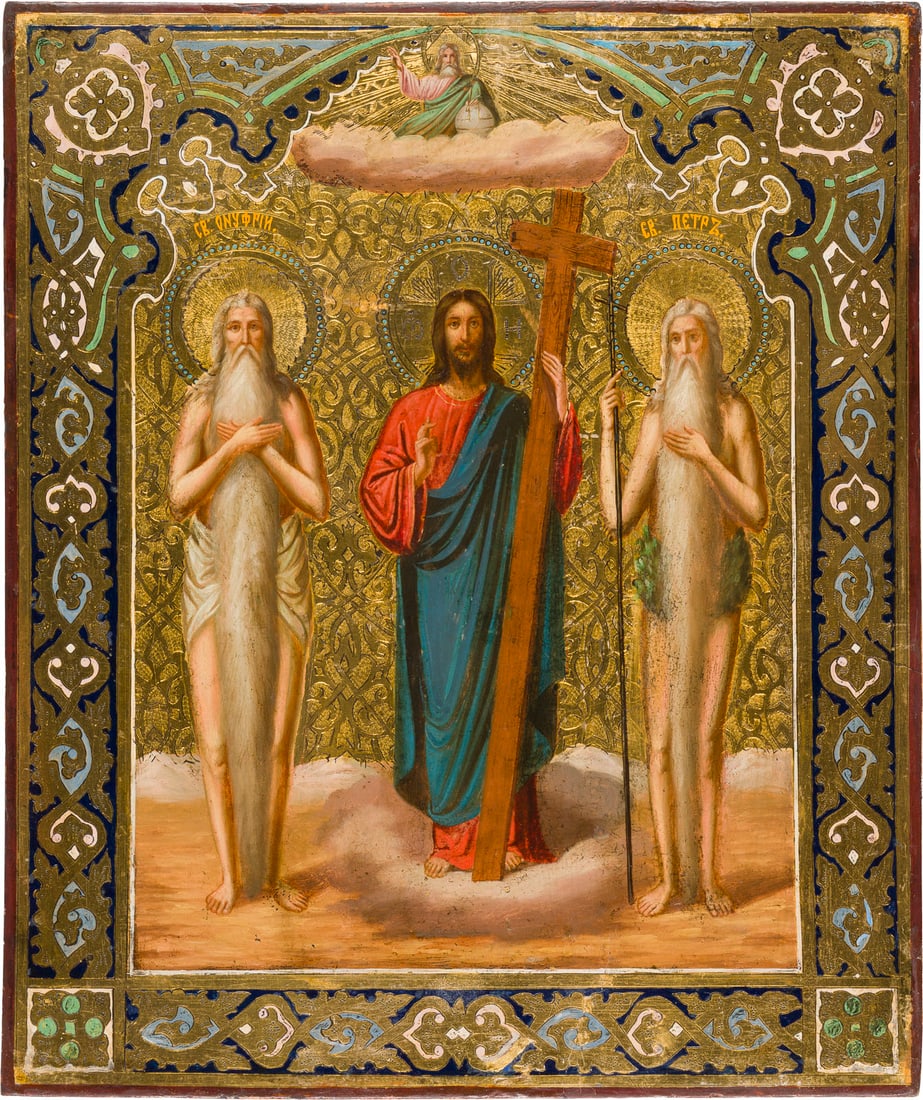 A RARE ICON WITH CHRIST AND THE HERMITS ONUPHRIUS AND PETER OF ATHOS: A RARE ICON WITH CHRIST AND THE HERMITS ONUPHRIUS AND PETER OF ATHOS Russian, circa 1900 Oil on wood panel. The highly detailed saints standing in full-length, the gold ground punched, the border deco