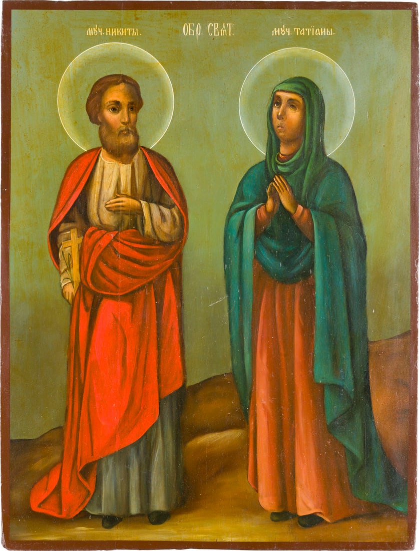 A LARGE ICON SHOWING STS. NIKITA AND TATIANA: A LARGE ICON SHOWING STS. NIKITA AND TATIANA Russian, 19th century Oil on wood panel. Minimally restored. 46.7 x 35.5 cm. GROSSE IKONE MIT DEN HEILIGEN NIKITA UND TATIANA Russland, 19. Jh. Verbund zwe