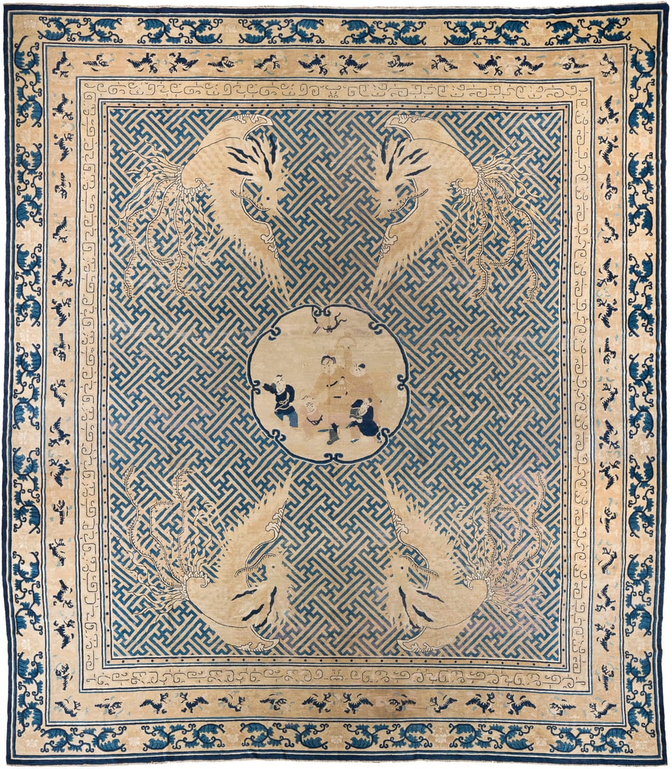 EIN NINGXIA-KANG-TEPPICH MIT DER DARSTELLUNG VON KNABEN UND SWASTIKA-MUSTER: A 'BOYS AND FRET-WORK' NINGXIA KANG CARPET China, 17th century Wool. 418 x 386 cm. The carpet centers on a medallion enclosing boys at play, surrounded in the four corners by phoenixes. The ground is 
