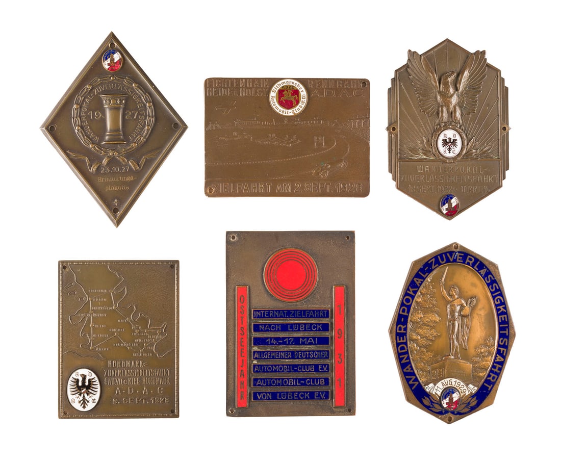 | SAMMLUNG AUS 6 ERINNERUNGSPLAKETTEN: SAMMLUNG AUS 6 ERINNERUNGSPLAKETTEN Deutsch, 1. H. 20. Jh. Bronze, Metall, Email. Max. 10 x 7 cm. 'Wanderpokal Zuverlässigkeitsfahrt 23.10.(19)27 - Motorfahrer-Club Schleswig'; 'Zielfahrt am 2. Sept.